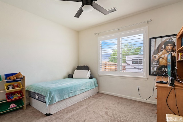 carpeted bedroom with ceiling fan