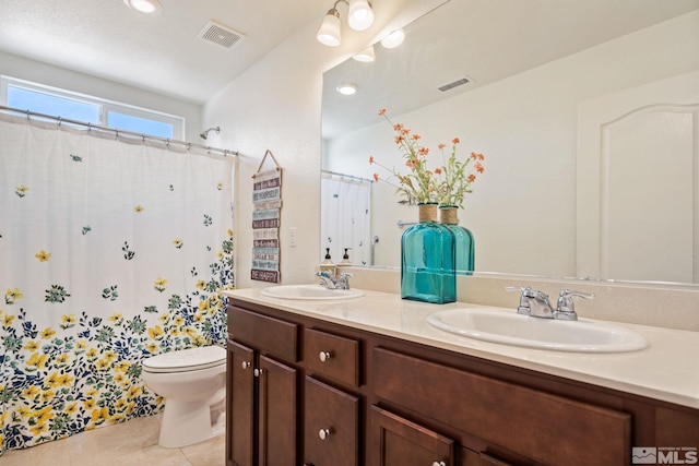 bathroom featuring tile patterned flooring, vanity, toilet, and a shower with shower curtain