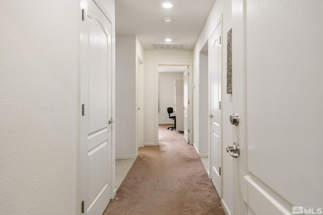 hallway with light carpet