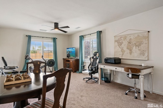 office space featuring carpet flooring, plenty of natural light, and ceiling fan