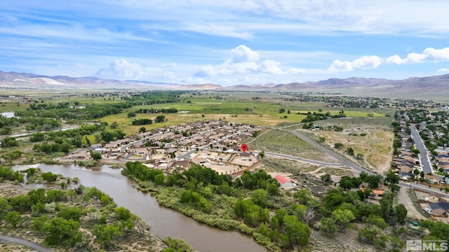 bird's eye view featuring a water and mountain view