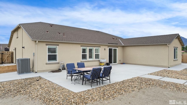 back of house with central AC and a patio