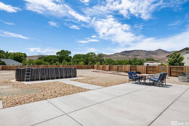 view of patio featuring a mountain view