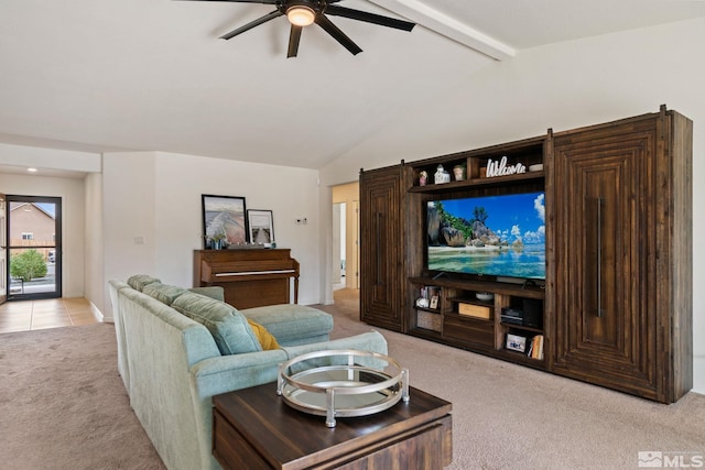 carpeted living room featuring vaulted ceiling with beams and ceiling fan