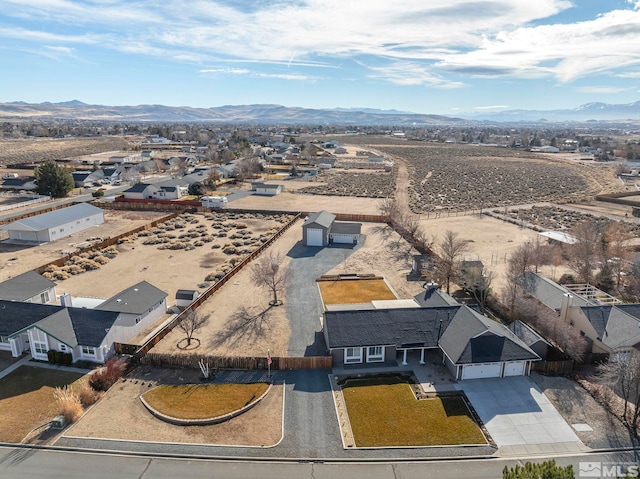 birds eye view of property with a mountain view