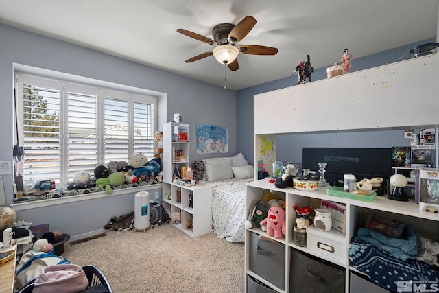 carpeted bedroom with ceiling fan