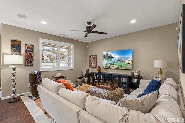 living room featuring hardwood / wood-style flooring and ceiling fan