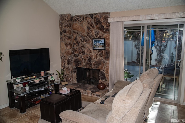 living room with a fireplace, a textured ceiling, lofted ceiling, and light tile patterned flooring