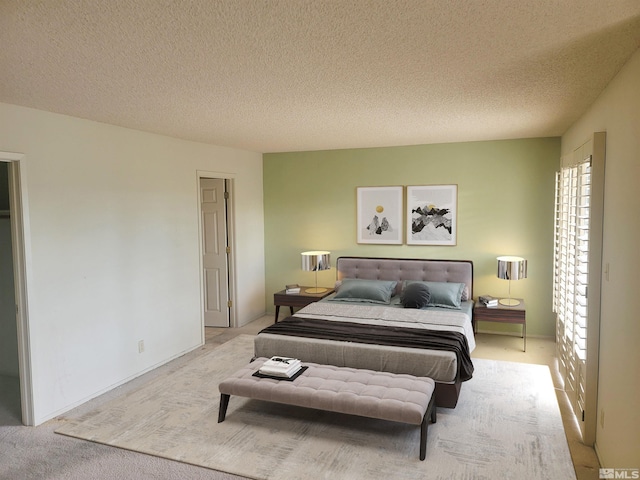 carpeted bedroom with a textured ceiling