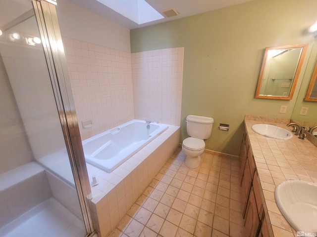 full bathroom with tile patterned floors, vanity, shower with separate bathtub, and toilet