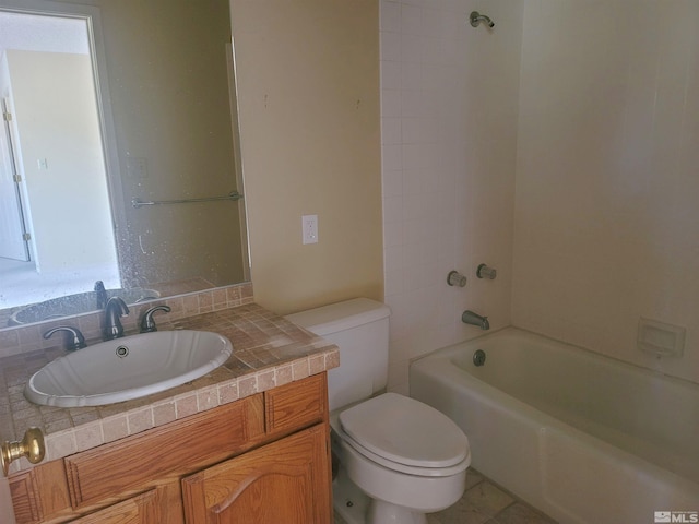 full bathroom featuring vanity, toilet, tiled shower / bath, and backsplash