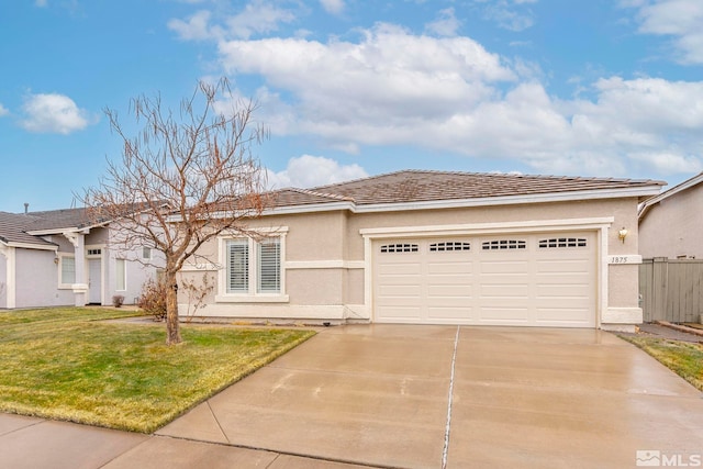 view of front of home featuring a garage and a front yard