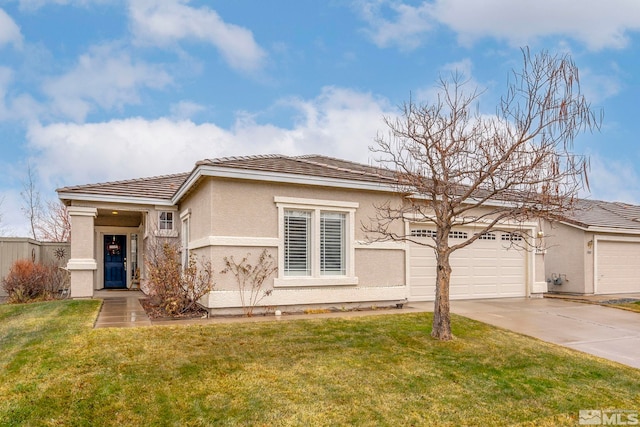 view of front facade featuring a front yard and a garage