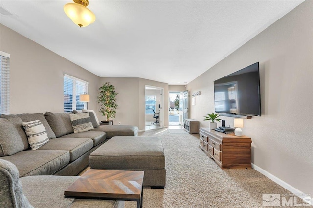 living room featuring light colored carpet