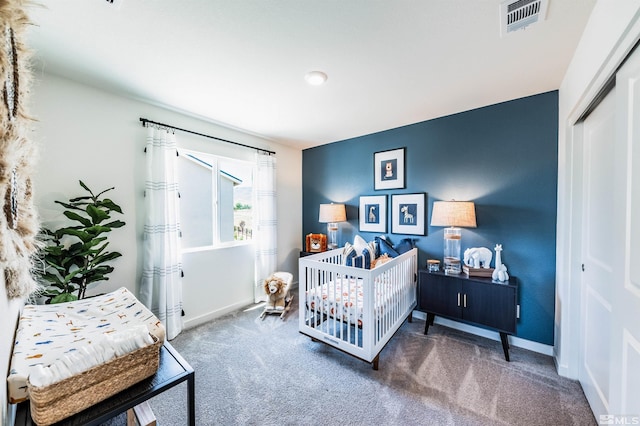 carpeted bedroom featuring a closet