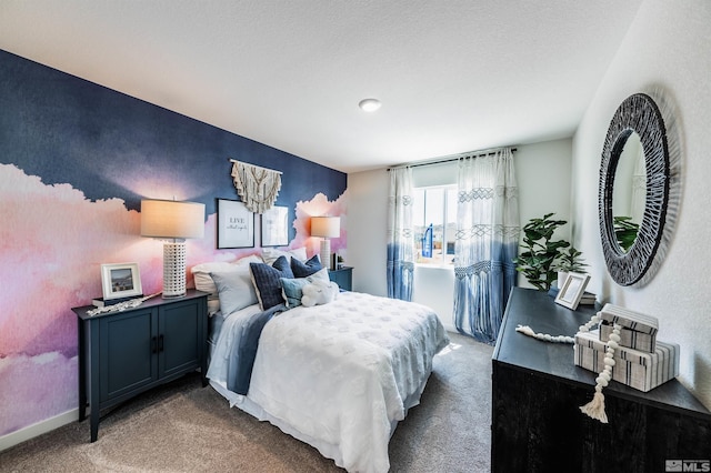 bedroom featuring carpet and a textured ceiling