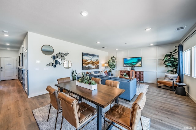 dining room with light hardwood / wood-style flooring