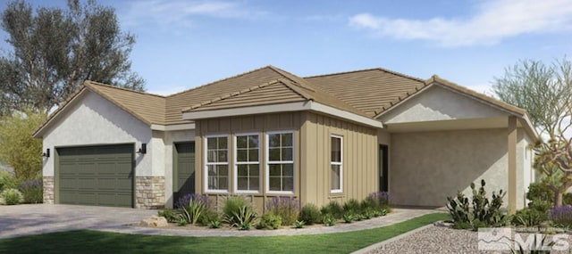 ranch-style home featuring stone siding, concrete driveway, an attached garage, and a tiled roof