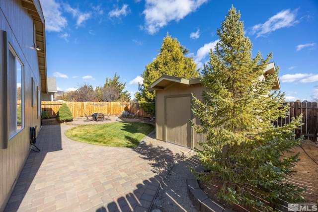 view of patio / terrace featuring a shed