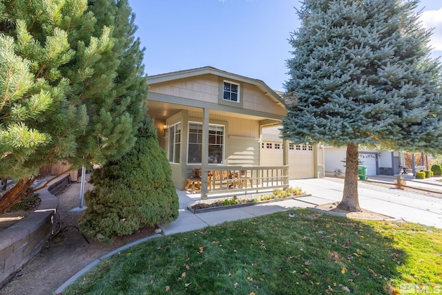 view of front of property with a garage and covered porch