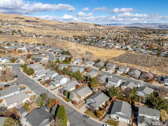 birds eye view of property with a mountain view