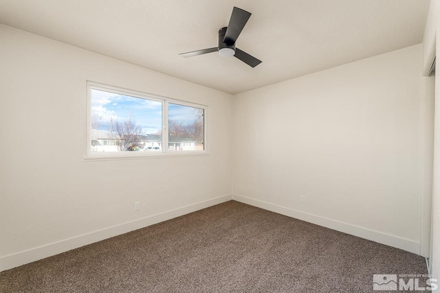 unfurnished room featuring ceiling fan and carpet floors