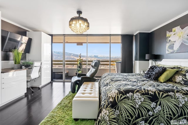 bedroom with access to exterior, dark hardwood / wood-style flooring, floor to ceiling windows, crown molding, and a mountain view