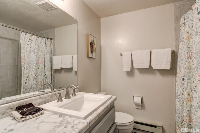 bathroom featuring vanity, a textured ceiling, a baseboard radiator, and toilet