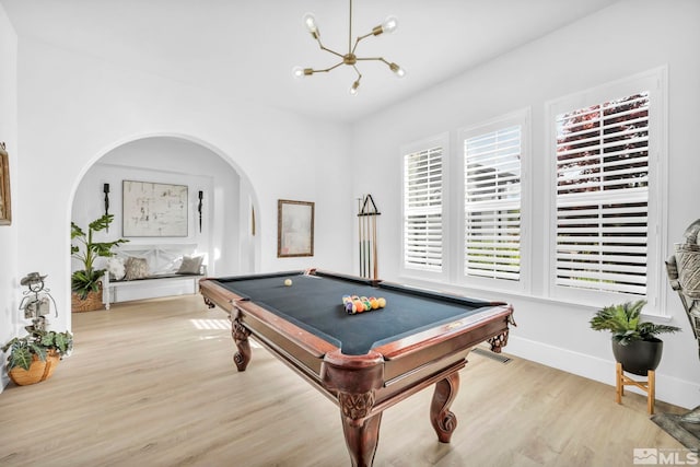 playroom with light hardwood / wood-style floors, a notable chandelier, and pool table