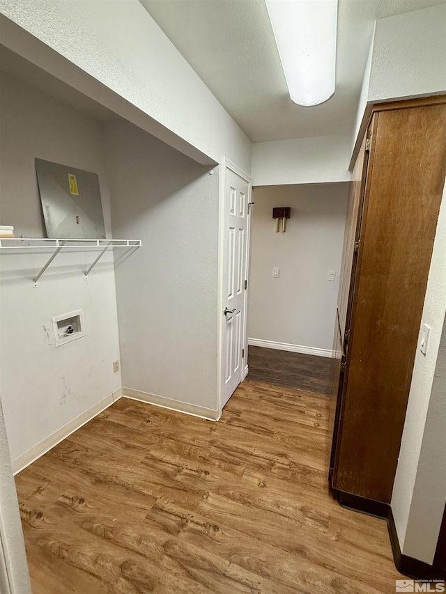 clothes washing area featuring wood-type flooring and washer hookup