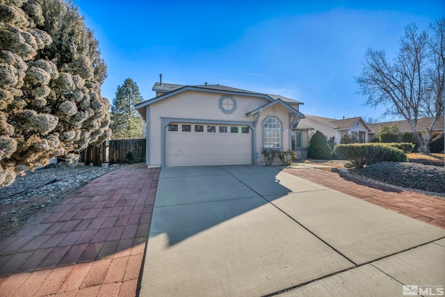 ranch-style home featuring a garage