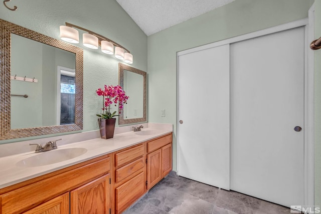 bathroom featuring vanity and a textured ceiling