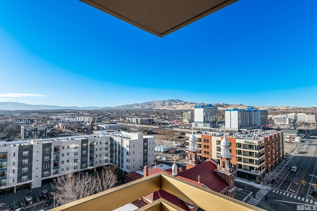 property's view of city with a mountain view