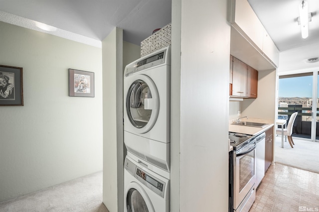 laundry area featuring sink, stacked washer / drying machine, and light carpet