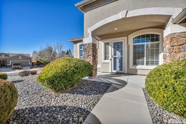 doorway to property with a garage