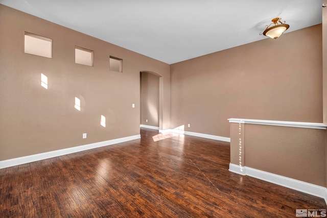 spare room featuring dark hardwood / wood-style flooring