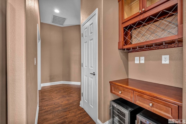 corridor with dark hardwood / wood-style flooring