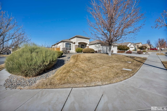 ranch-style home featuring a front yard