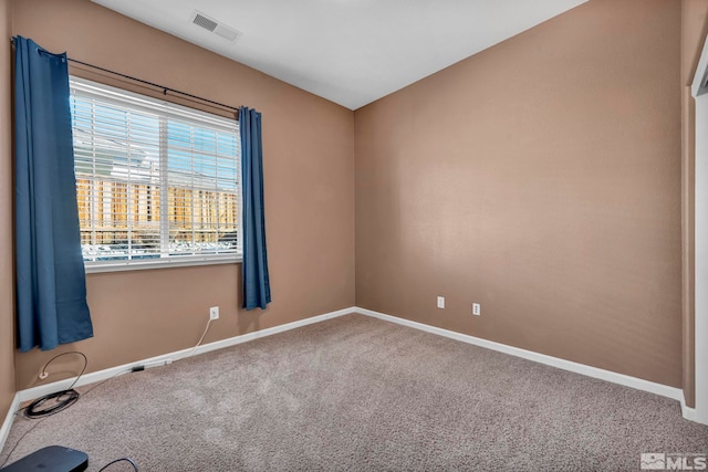 spare room featuring carpet flooring