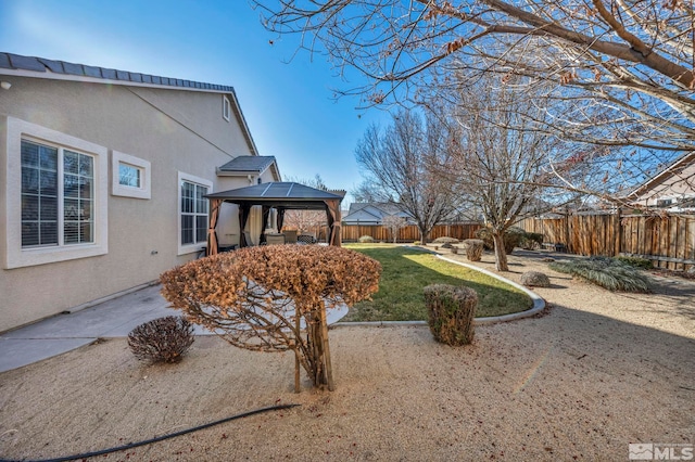 view of yard with a patio and a gazebo