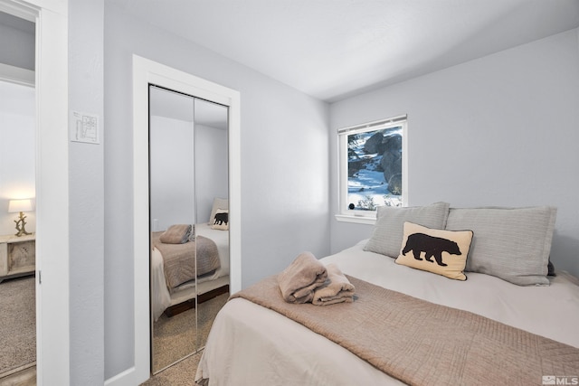 carpeted bedroom with a closet