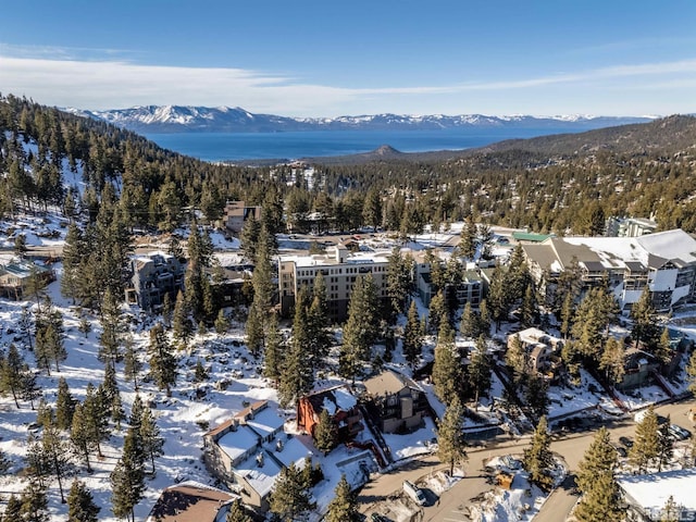 snowy aerial view with a mountain view