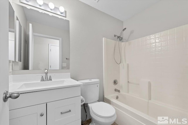 full bathroom with bathing tub / shower combination, vanity, and toilet