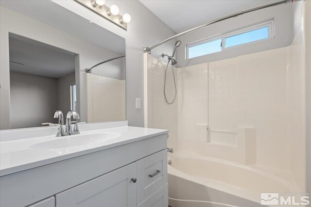 bathroom featuring shower / tub combination and vanity