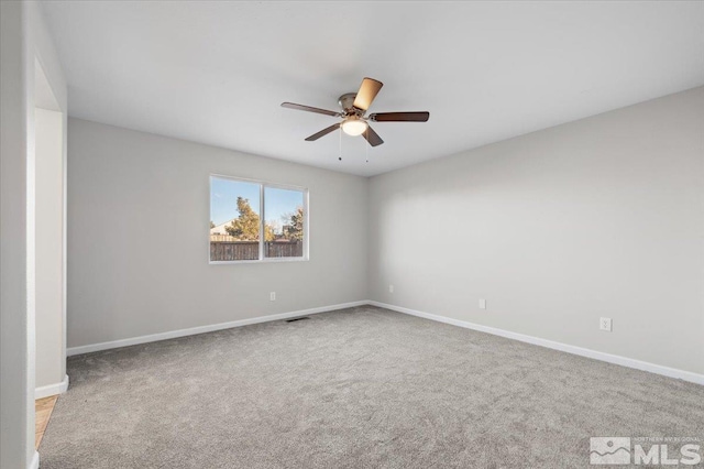 carpeted empty room with ceiling fan