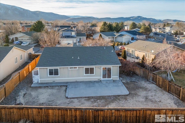 birds eye view of property featuring a mountain view