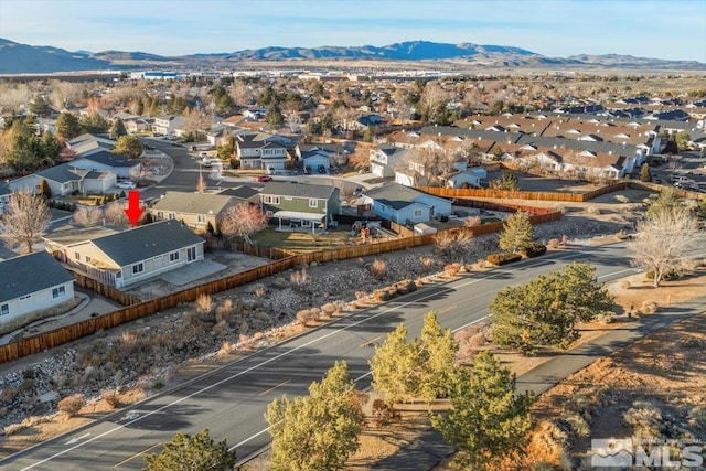 birds eye view of property featuring a mountain view