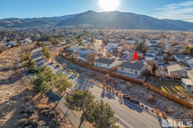 birds eye view of property with a mountain view