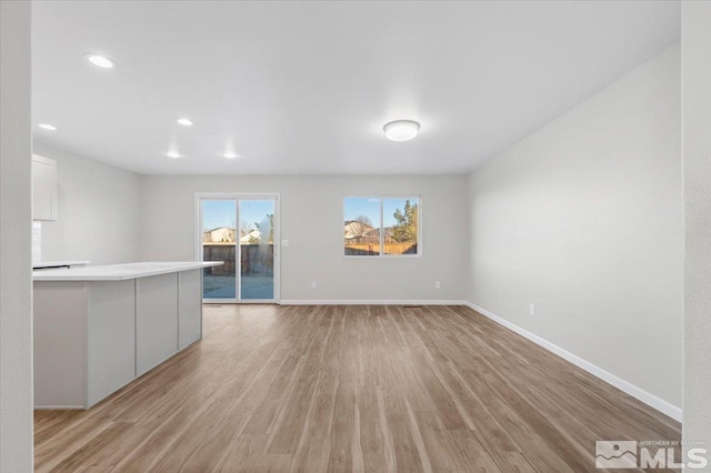 unfurnished living room with light hardwood / wood-style flooring