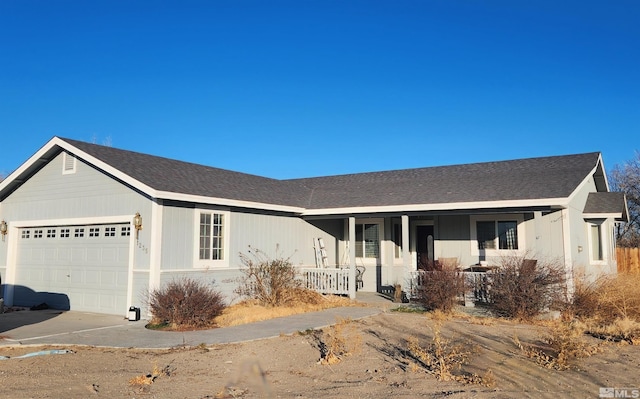 ranch-style house featuring a porch and a garage